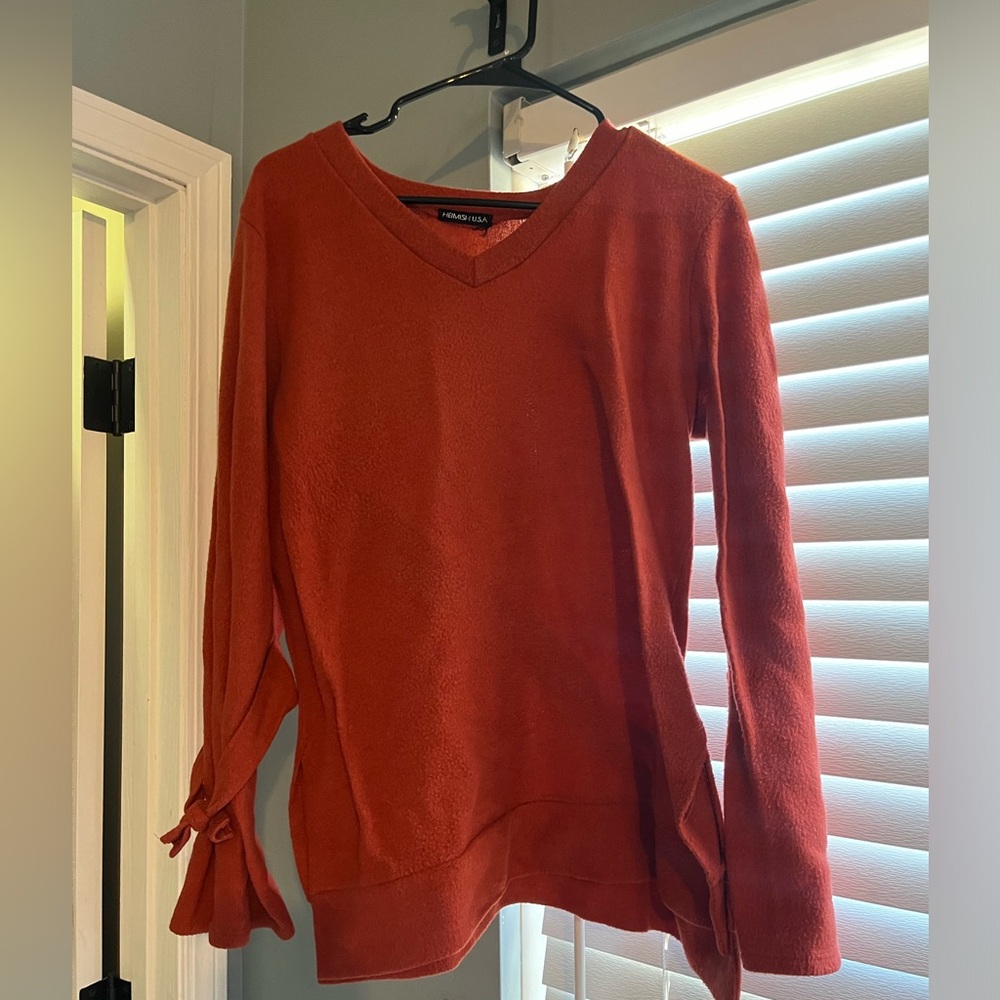 Women’s orange sweater. Size Large